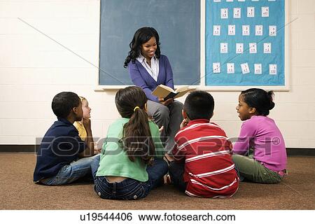 Stock Photograph - Teacher Reading to Students. Fotosearch