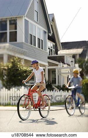 Teens Riding Bicycles View Large Photo Image Picture - Teens Riding Bicycles. Fotosearch