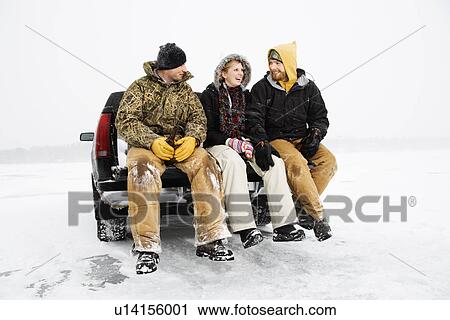 Stock Image - Three People Having a Beer. Fotosearch