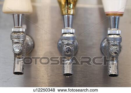 Stock Photo - Trio of Beer Tap Spouts. Fotosearch