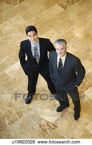 Stock Photo - Two Confident Businessmen. Fotosearch