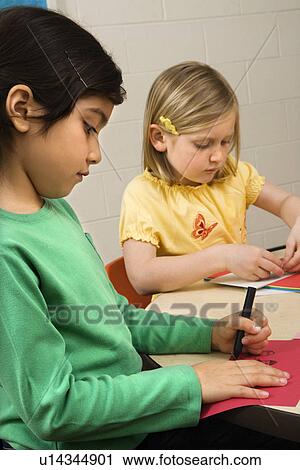 Stock Image - Two Girls in Art Class. Fotosearch