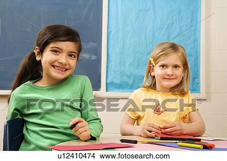Picture - Two Girls in Classroom.. Fotosearch