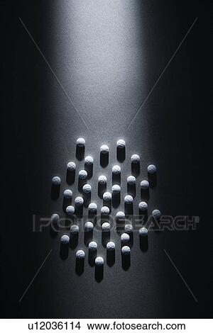 Picture - White Pills in a Circle. Fotosearch