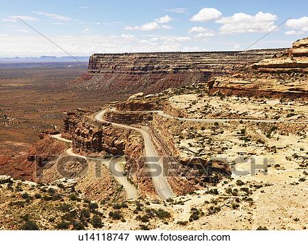 Stock Photo - Winding Road on Rugged Desert Rock Formation. Fotosearch