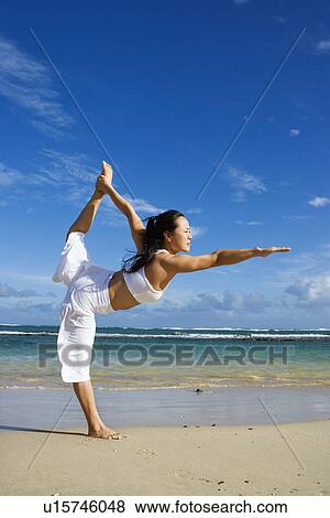 Woman Doing Yoga on Beach View Large Photo Image Stock Photo - Woman Doing Yoga on Beach. Fotosearch