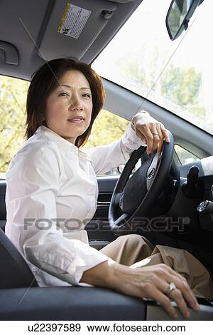 Woman driver View Large Photo Image Stock Photo - Woman driver. Fotosearch