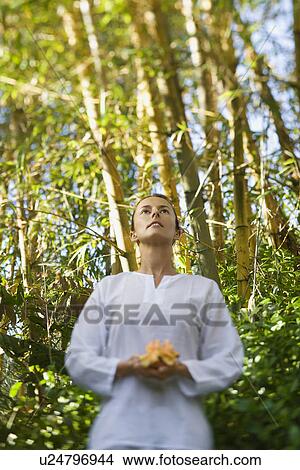 Woman Holding Flower Outdoors View Large Photo Image Picture - Woman Holding Flower Outdoors. Fotosearch