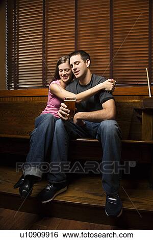 Woman Hugging Her Boyfriend View Large Photo Image Stock Photograph - Woman Hugging Her Boyfriend. Fotosearch