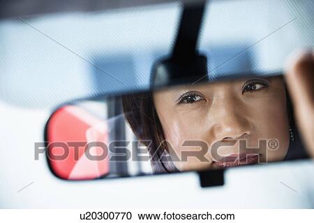 Woman in rearview mirror View Large Photo Image Stock Image - Woman in rearview mirror. Fotosearch