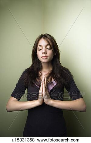 Stock Photo - Woman meditating. Fotosearch