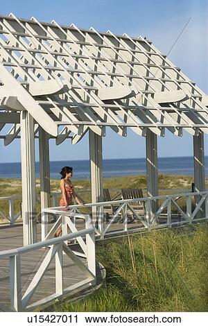 Woman on arbor looking at Ocean View Large Photo Image Stock Image - Woman on arbor looking at Ocean. Fotosearch