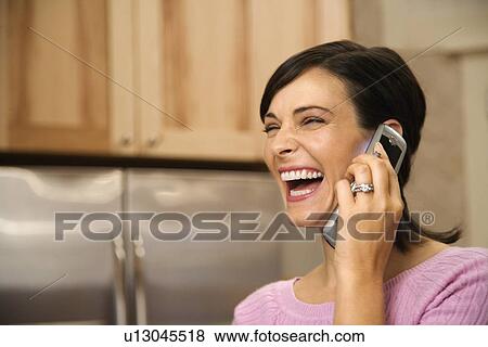Stock Photo - Woman on Cell Phone Laughing. Fotosearch