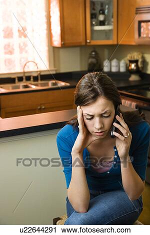 Stock Image - Woman on cellphone. Fotosearch