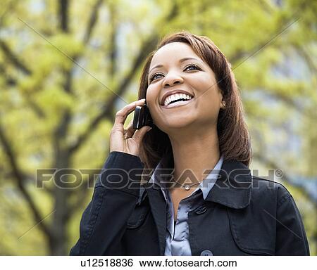 Woman on mobile phone View Large Photo Image Stock Photograph - Woman on mobile phone. Fotosearch
