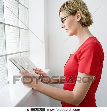 Woman reading book View Large Photo Image Stock Photography - Woman reading book. Fotosearch
