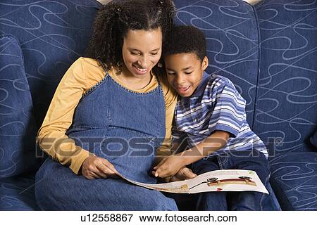 Woman Reading Book to Son View Large Photo Image Stock Photo - Woman Reading Book to Son. Fotosearch