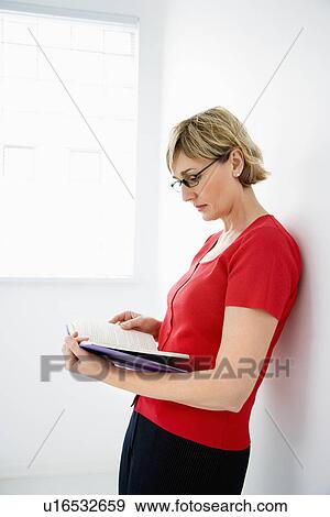 Woman reading View Large Photo Image Stock Photo - Woman reading. Fotosearch