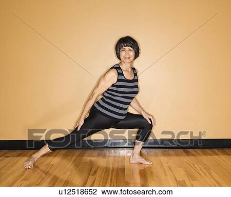 Woman Stretches Leg in Yoga Pose View Large Photo Image Stock Image - Woman Stretches Leg in Yoga Pose. Fotosearch