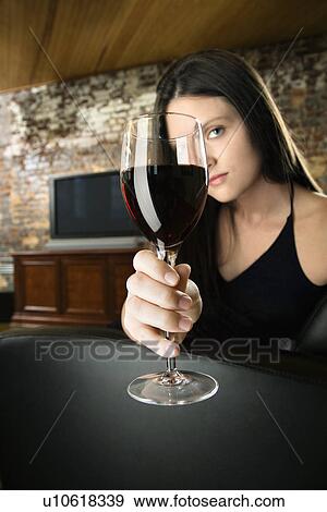 Stock Photo - Woman toasting wine glass. Fotosearch