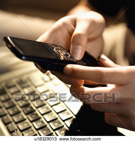 Woman using cellphone View Large Photo Image Stock Image - Woman using cellphone. Fotosearch