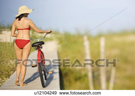 Woman with Bicycle at Beach View Large Photo Image Stock Photo - Woman with Bicycle at Beach. Fotosearch