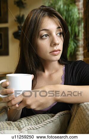Stock Image - Woman with coffee cup. Fotosearch