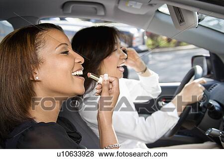 Stock Photo - Women friends in car.. Fotosearch