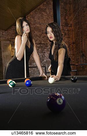 Women playing billiard game. View Large Photo Image Stock Photograph - Women playing billiard game.. Fotosearch