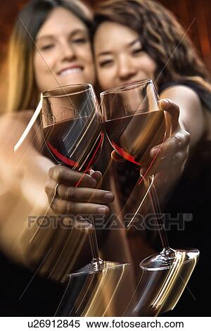 Women with red wine View Large Photo Image Stock Photography - Women with red wine. Fotosearch