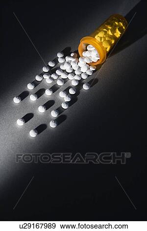 Yellow Medicine Bottle Spilling Pills View Large Photo Image Stock Photo - Yellow Medicine Bottle Spilling Pills. Fotosearch
