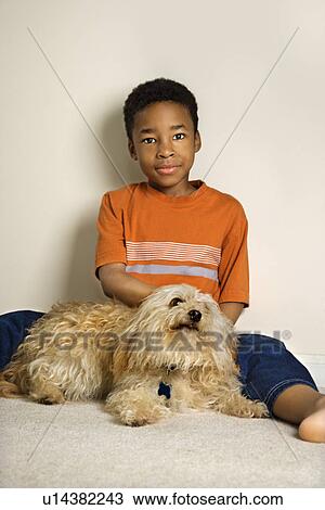 Stock Image - Young Boy with Dog. Fotosearch