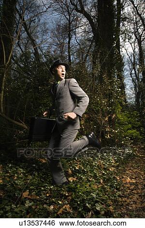 Young Businessman Running In Woods View Large Photo Image Stock Photograph - Young Businessman Running In Woods. Fotosearch