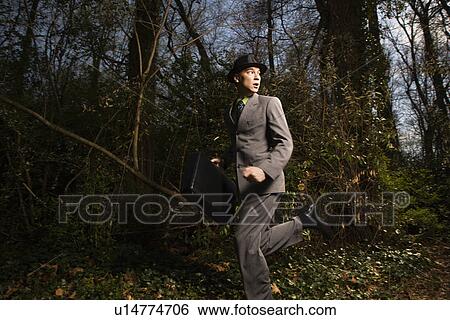 Young Businessman Running In Woods View Large Photo Image Stock Photograph - Young Businessman Running In Woods. Fotosearch