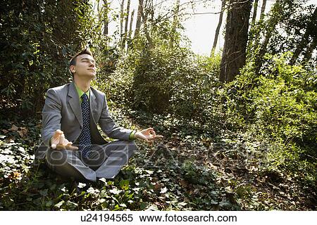 Young Businessman Sitting in Meditation View Large Photo Image Stock Photography - Young Businessman Sitting in Meditation. Fotosearch