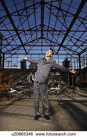 Young Businessman Smiling With Arms Open View Large Photo Image Stock Photograph - Young Businessman Smiling With Arms Open. Fotosearch