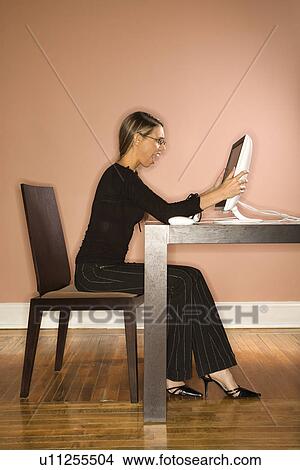 Young Businesswoman Looking at Computer Surprised View Large Photo Image Picture - Young Businesswoman Looking at Computer Surprised. Fotosearch