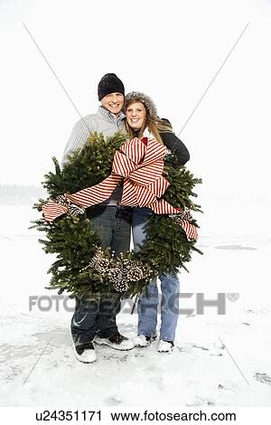Young Couple Hugging with Wreath View Large Photo Image Stock Image - Young Couple Hugging with Wreath. Fotosearch