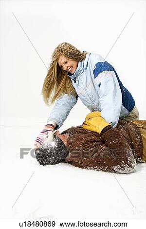 Young Couple Playing in Snow View Large Photo Image Stock Photo - Young Couple Playing in Snow. Fotosearch
