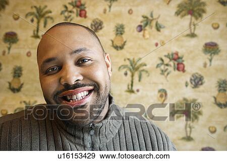 Young Man Smiling at Camera View Large Photo Image Stock Photo - Young Man Smiling at Camera. Fotosearch