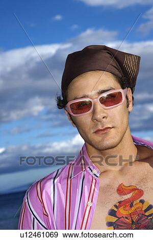 Stock Photo - Young Man With Sunglasses and Headscarf. Fotosearch