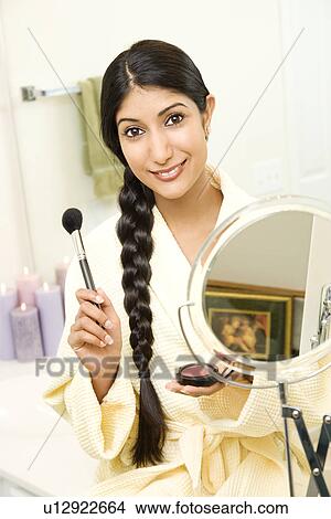 Young Woman Applying Makeup View Large Photo Image Picture - Young Woman Applying Makeup. Fotosearch