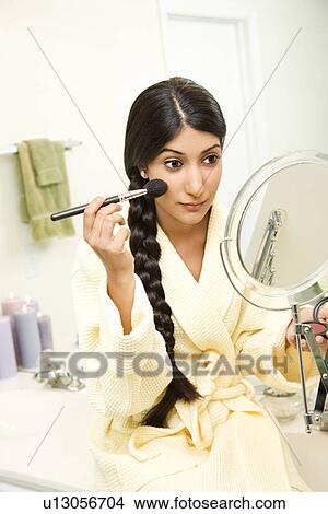 Young Woman Applying Makeup View Large Photo Image Picture - Young Woman Applying Makeup. Fotosearch
