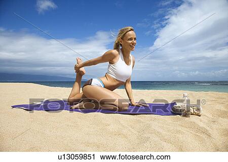 Young Woman Doing Yoga on Beach View Large Photo Image Stock Image - Young Woman Doing Yoga on Beach. Fotosearch