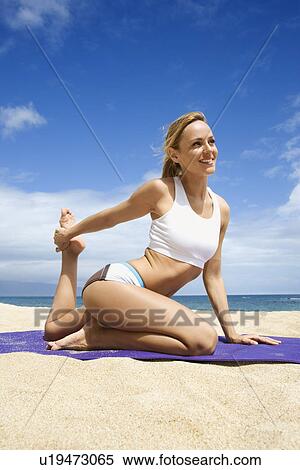 Young Woman Doing Yoga on Beach View Large Photo Image Stock Photography - Young Woman Doing Yoga on Beach. Fotosearch