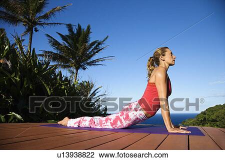 Stock Image - Young Woman Doing Yoga. Fotosearch