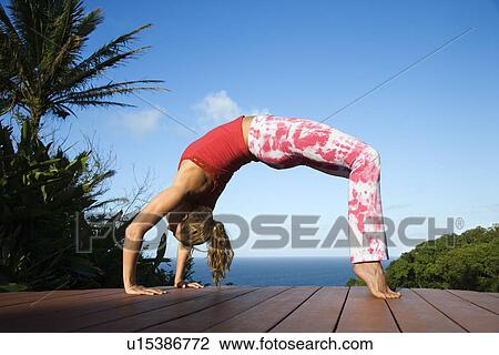 Stock Image - Young Woman Doing Yoga. Fotosearch