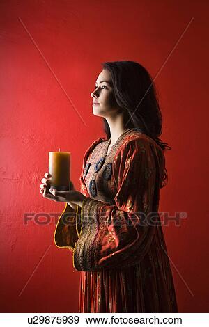 Stock Photo - Young Woman Holding Candle. Fotosearch