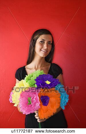 Young Woman Holding Paper Flowers, Isolated View Large Photo Image Stock Photo - Young Woman Holding Paper Flowers, Isolated. Fotosearch