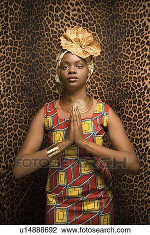 Young Woman Praying and Wearing Traditional African Dress View Large Photo Image Stock Image - Young Woman Praying and Wearing Traditional African Dress. Fotosearch